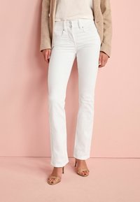 Клешеные брюки Клешеные брюки