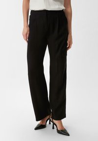 Брюки с накладными карманами Брюки с накладными карманами