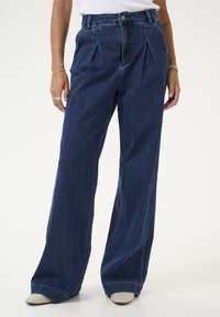 Клешеные джинсы Клешеные джинсы