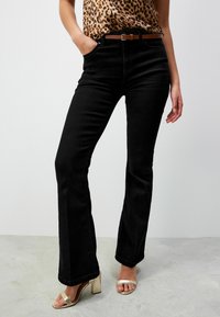 Клешеные брюки Клешеные брюки