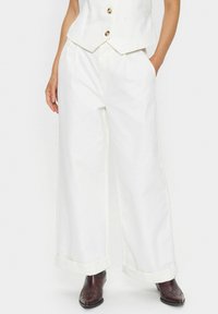 Клешеные джинсы Клешеные джинсы