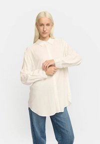 Длинная блузка Длинная блузка