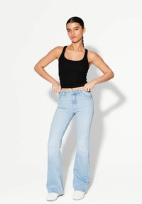 Клешеные брюки Клешеные брюки