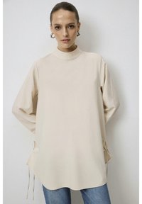 Длинная блузка Длинная блузка