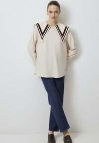 Длинная блузка Длинная блузка