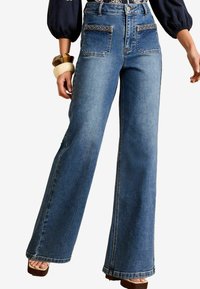 Клешеные джинсы Клешеные джинсы