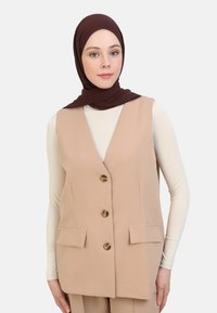 Длинный жилет Длинный жилет