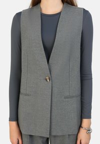 Длинный жилет Длинный жилет