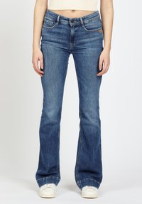 Клешеные брюки Клешеные брюки