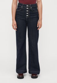 Клешеные джинсы Клешеные джинсы