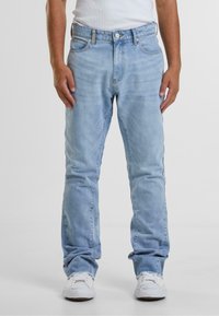 Клешеные джинсы Клешеные джинсы