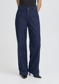 Клешеные джинсы Клешеные джинсы