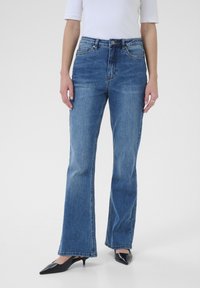 Клешеные брюки Клешеные брюки