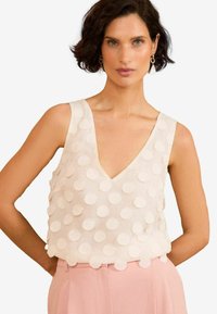 Блузка без рукавов Блузка без рукавов