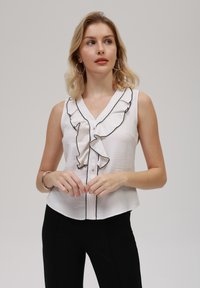 Блузка без рукавов Блузка без рукавов