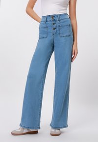 Клешеные джинсы Клешеные джинсы