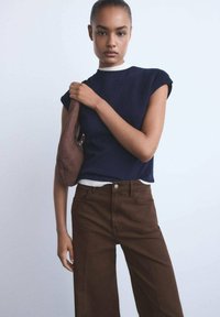 Клешеные джинсы Клешеные джинсы