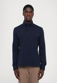 Поло с длинным рукавом Поло с длинным рукавом