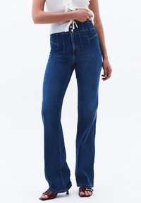 Клешеные брюки Клешеные брюки