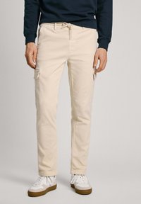 Брюки с накладными карманами Брюки с накладными карманами