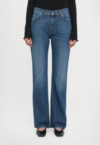 Клешеные джинсы Клешеные джинсы