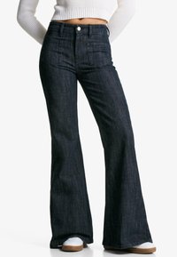 Клешеные брюки Клешеные брюки