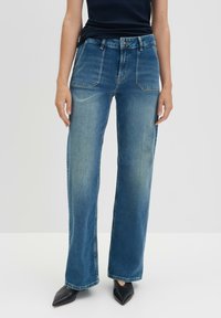 Клешеные джинсы Клешеные джинсы