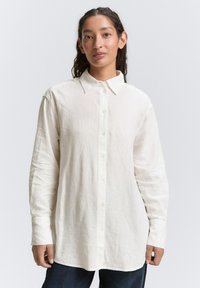 Длинная блузка Длинная блузка