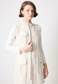 Длинный жилет Длинный жилет