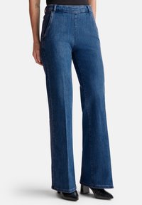 Клешеные джинсы Клешеные джинсы