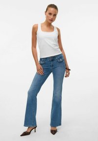 Клешеные джинсы Клешеные джинсы