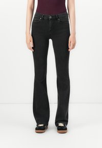 Клешеные джинсы Клешеные джинсы