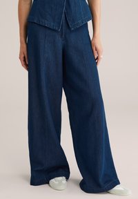 Клешеные джинсы Клешеные джинсы