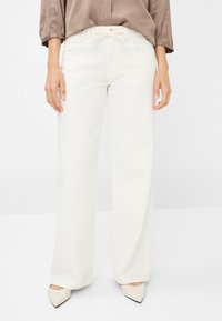 Клешеные джинсы Клешеные джинсы