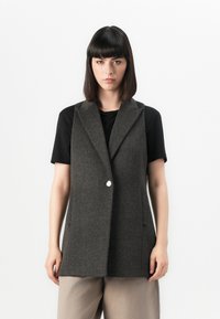 Длинный жилет Длинный жилет