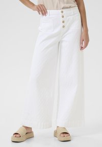 Клешеные джинсы Клешеные джинсы