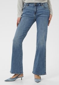 Клешеные брюки Клешеные брюки