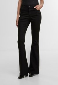 Клешеные брюки Клешеные брюки