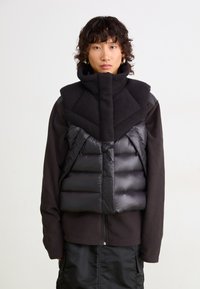 Пуховой жилет Пуховой жилет