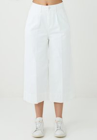 Клешеные джинсы Клешеные джинсы