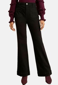 Клешеные джинсы Клешеные джинсы