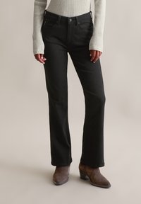 Клешеные джинсы Клешеные джинсы