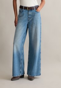 Клешеные джинсы Клешеные джинсы