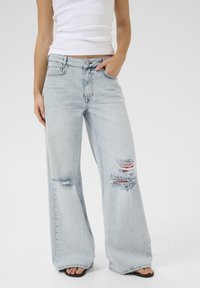 Клешеные джинсы Клешеные джинсы