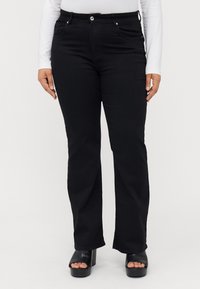 Клешеные джинсы Клешеные джинсы