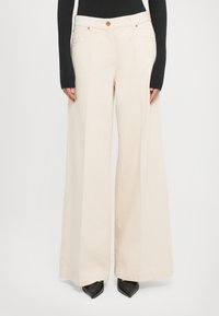 Клешеные джинсы Клешеные джинсы