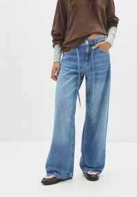 Свободные джинсы Свободные джинсы