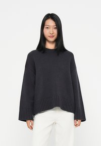 Длинный пуловер Длинный пуловер