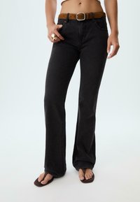 Клешеные джинсы Клешеные джинсы