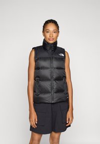 Пуховой жилет Пуховой жилет